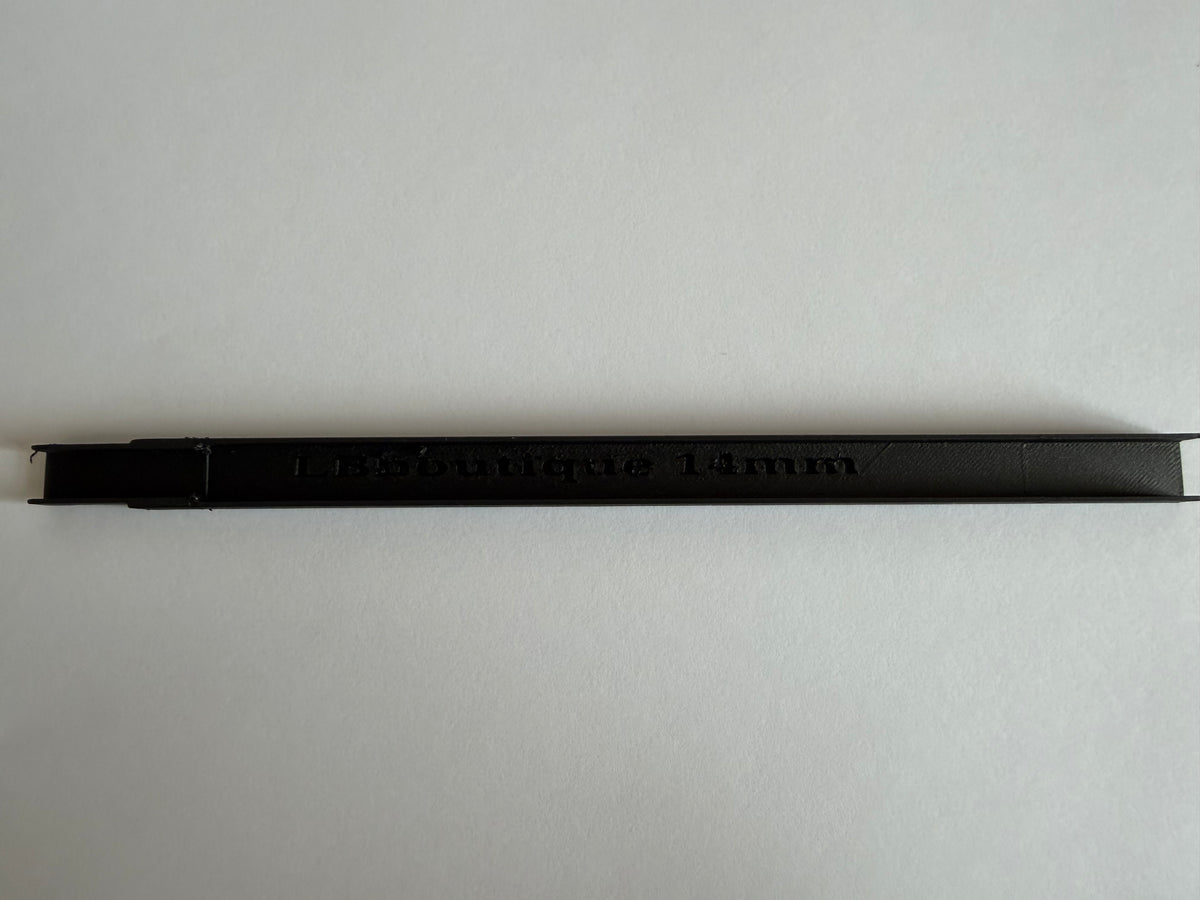 Black cable duct cover on a plain background, showing the LB Boutique embossed branding