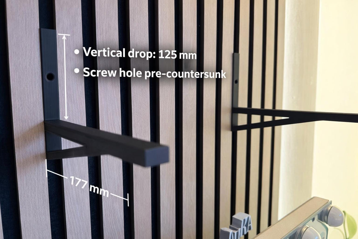 Black shelf bracket dimension diagram showing vertical drop and screw hole placement