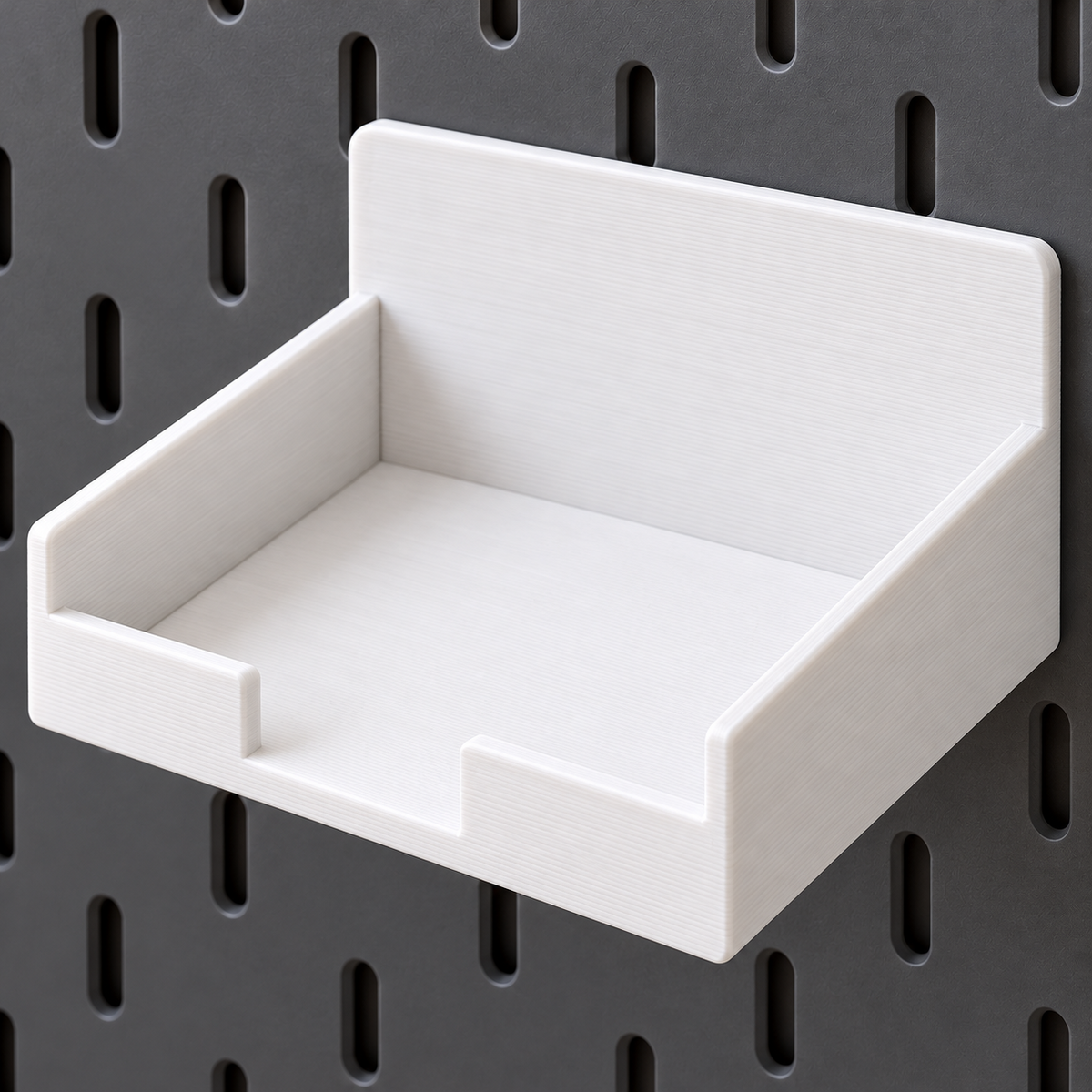 White pegboard tray shelf mounted on a pegboard