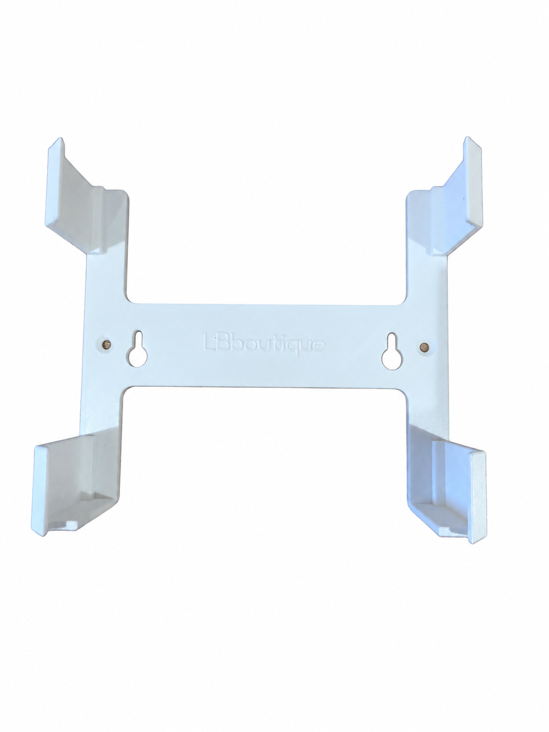 White wall mount bracket holding a UniFi Cloud Gateway Ultra