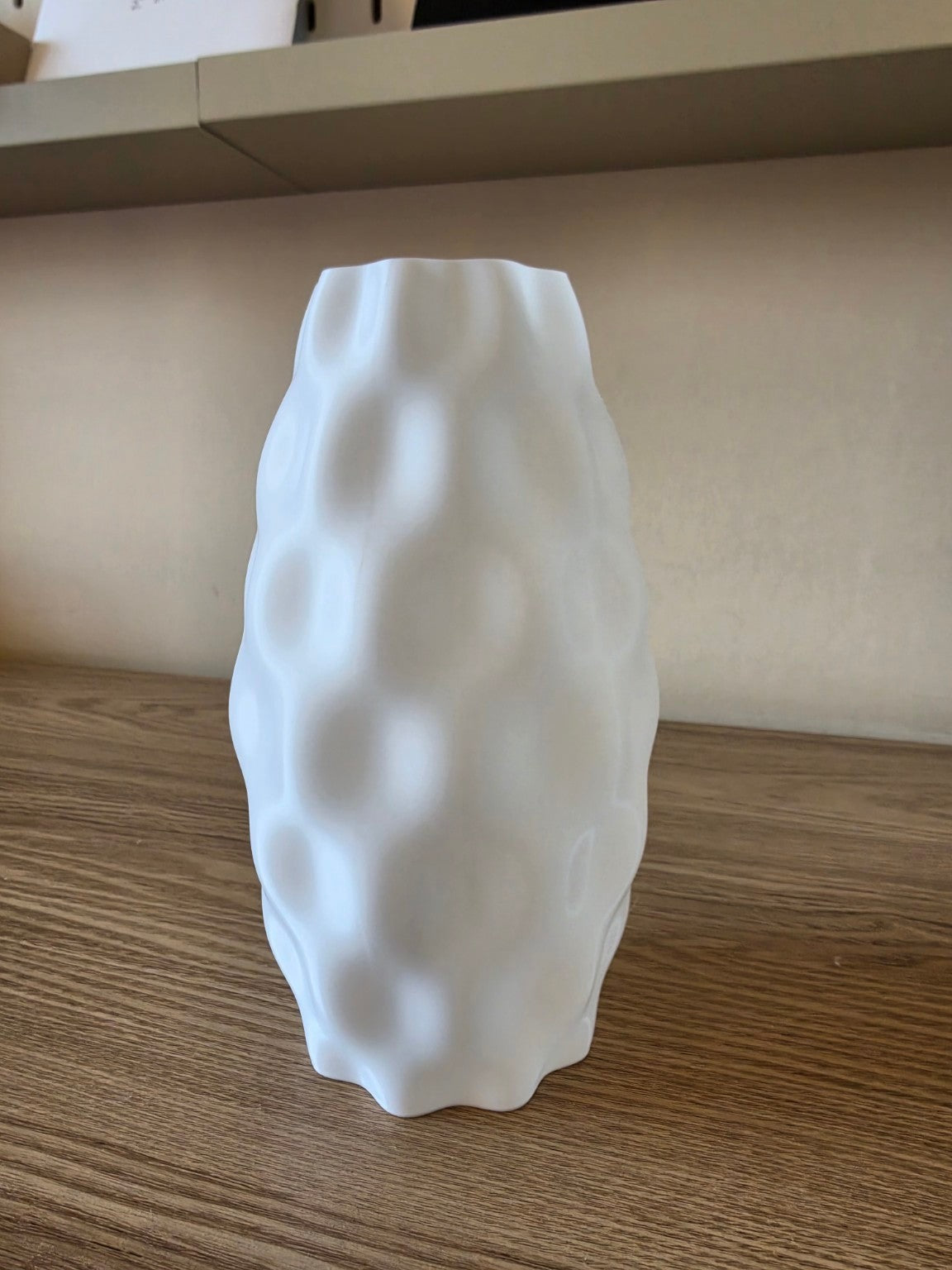 Textured bubble vase styled on a shelf