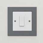 Self-adhesive backing on the switch surround